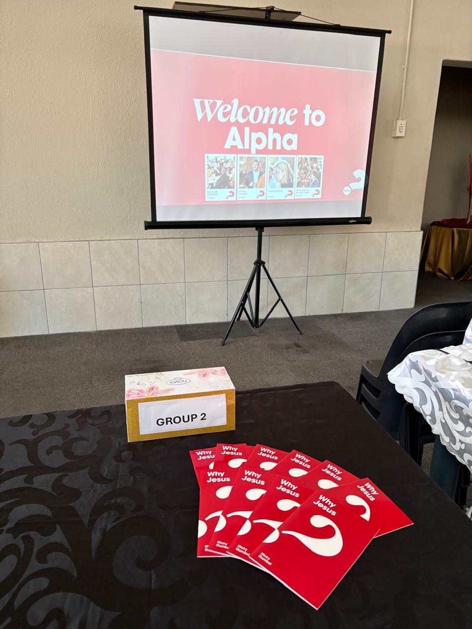 “Why Jesus” booklets and group materials laid out on a table