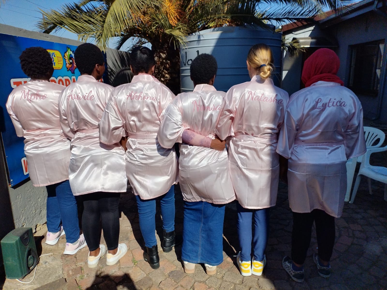 Women standing together in personalised robes